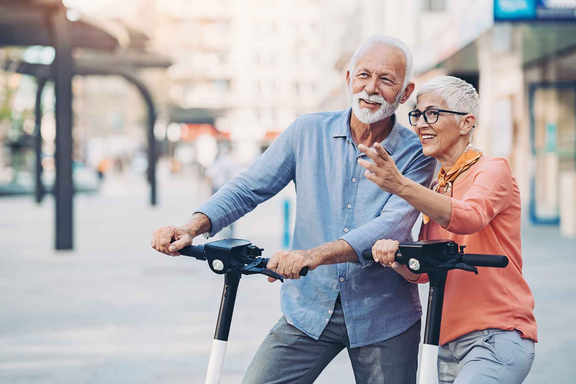 Senior couple with scooters