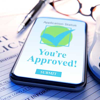 Hearing Aid financing approval notification received on a cell phone.